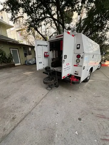 Magnet Plumbing service vehicle on-site for Grease Trap Cleaning in Oak Court